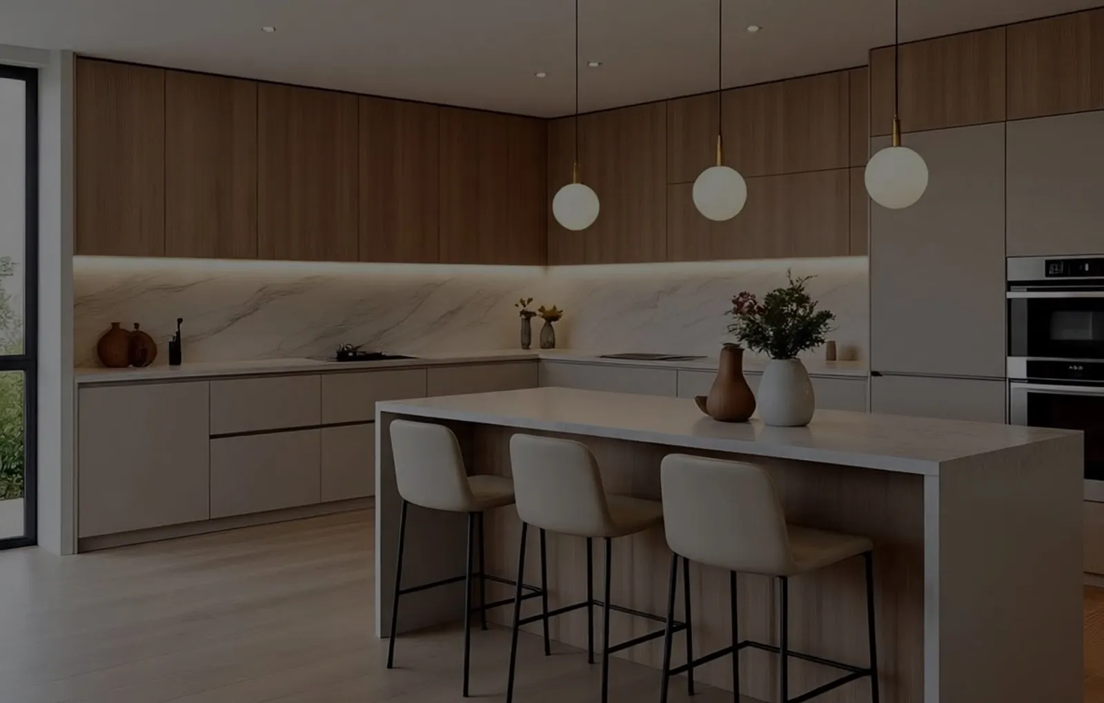 Kabeenet kitchen with oak cabinetry, a marble backsplash and globe pendant lights